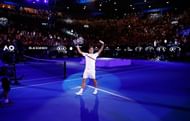 Roger Federer celebrates after winning the 2018 Australian Open